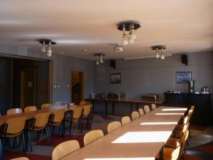 a room with a long table and chairs at Hotel Sowa in Częstochowa