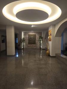 a large room with a ceiling with a circular light fixture at Jomtien Hill Resort Pratamnak in Pattaya South +258 photos