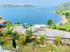 a view of a body of water with a beach at Amara Kivu Resort in Île Bugarura