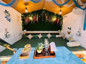 a room with a table in a tent at Prathvi Cottages-04 in Lucknow