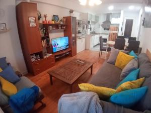 a living room with a couch and a table at MERINDADES AMAZUL MILANO - Piso turístico - Medina de Pomar in Medina de Pomar +47 photos