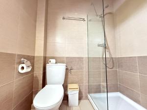 a bathroom with a toilet and a glass shower at Agi Josep Sabater in Roses +22 photos