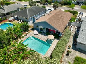 an aerial view of a house with a swimming pool at PrivateTropical Oasis in Jax Beach in Jacksonville Beach