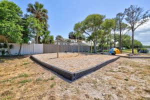 a playground with a swing set in a yard at PrivateTropical Oasis in Jax Beach in Jacksonville Beach +33 photos