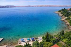 an aerial view of a large body of water at Apartmani Ribarica**** in Karlobag +19 photos