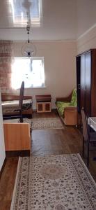 a living room with a couch and a table at Лазурит in Tamga