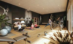 a group of people doing yoga in a gym at Le PIC in Clermont-Ferrand