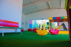 a play room with three slides and a table at Lacqua Diroma 12345 Caldas Novas in Caldas Novas