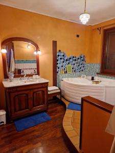 a large bathroom with a tub and a sink at B&B Art Experience Novecento e Dintorni in Monte Grimano Terme +67 photos