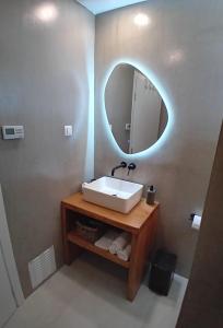 a bathroom with a sink and a mirror at Endless Blue Anesea House in Provatas