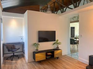 a living room with a flat screen tv on a wall at Lily's Place in Wexford
