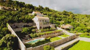 an aerial view of a castle on a mountain at Renaissance Palace Ghetaldi 1516 in Suđurađ
