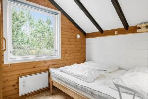 a bedroom with a bed and a window at 692-Thisted-Mose-Bollevej-6 in Thisted