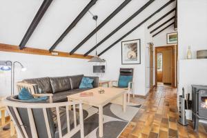a living room with a couch and a table at 692-Thisted-Mose-Bollevej-6 in Thisted