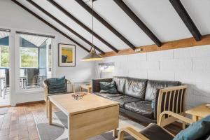 a living room with a couch and a table at 692-Thisted-Mose-Bollevej-6 in Thisted