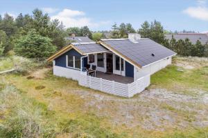a small house with a roof on a field at 692-Thisted-Mose-Bollevej-6 in Thisted