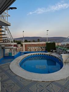 a swimming pool on the roof of a house at Casa Rosa in Tequesquitengo
