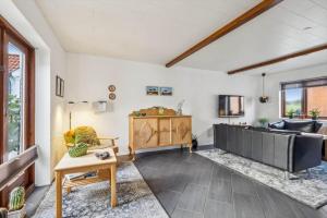 a living room with a tub and a table at 1075-Hanstholm-Badsgardsvej-25 in Hanstholm
