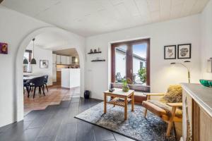a living room with a couch and a table at 1075-Hanstholm-Badsgardsvej-25 in Hanstholm