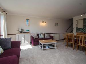 a living room with a couch and a table at 2 Bed in Bridport oc-dc162 in Chideock +15 photos