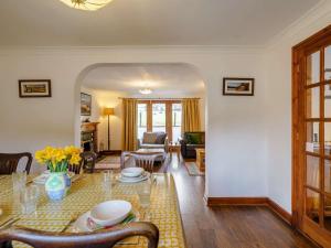 a living room with a table and a living room at 3 Bed in Penrith oc-90990 in Pooley Bridge +11 photos