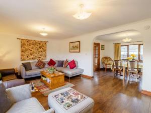a living room with a couch and a table at 3 Bed in Penrith oc-90990 in Pooley Bridge