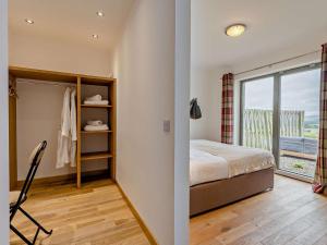 a bedroom with a bed and a window at 2 Bed in Forfar oc-92621 in Aberlemno +25 photos