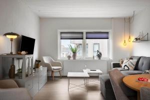 a living room with a couch and a table at 890-Hvide-Sande-Bredgade-3-B-1 in Hvide Sande