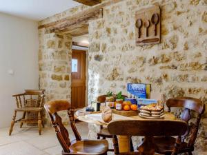 a room with a table with food on it at 2 Bed in Bridport oc-dc081 in Loders +12 photos