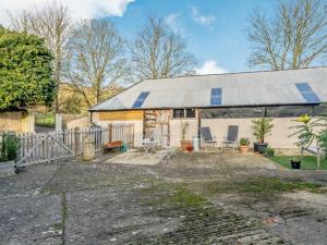 an old house with a tin roof on a driveway at 2 Bed in Bridport oc-dc081 in Loders