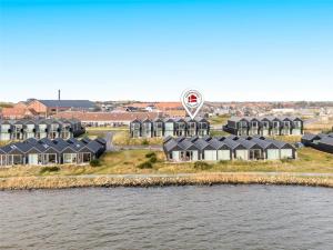an aerial view of a village with houses and a hot air balloon at 727-Hvide-Sande-Slusen-27 in Hvide Sande