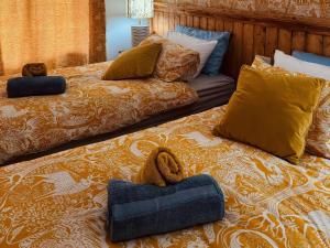 two beds sitting next to each other in a bedroom at Fisherman Lodge No 2 in Enniskillen