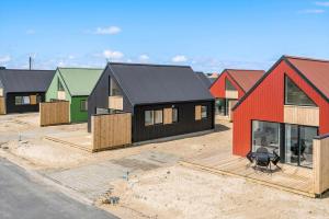 a row of houses in a parking lot at 941-Hvide-Sande-Langsand-167 in Hvide Sande