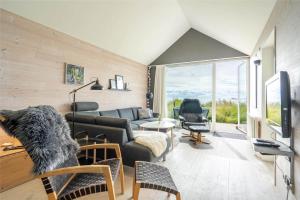 a living room with a couch and a table at 706-Hvide-Sande-Slusen-6 in Hvide Sande