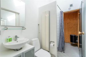 a bathroom with a sink and a toilet and a mirror at 706-Hvide-Sande-Slusen-6 in Hvide Sande +20 photos
