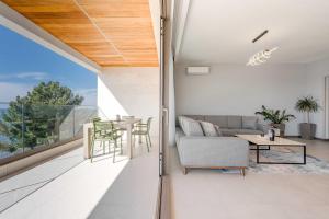 a living room with a couch and a table at SeaLine Residence in Bar