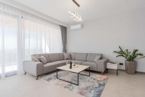 a living room with a couch and a table at SeaLine Residence in Bar