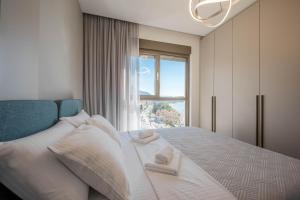 a bedroom with a bed with a window at SeaLine Residence in Bar