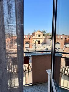 a view of a city from a window at A due passi dalla Certosa in Certosa di Pavia