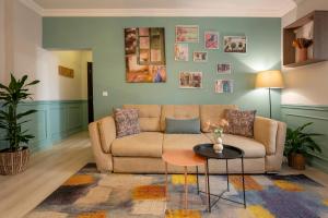 a living room with a couch and a table at Smart Apartments Central in Sighişoara +20 photos