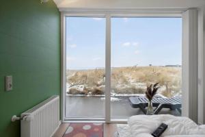 a room with a large window with a view at 745-Hvide-Sande-Slusen-45 in Hvide Sande