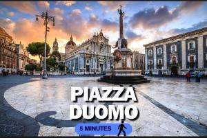 a city square with a plaza durcano in front of a building at Vulcano Rooms 3 in Catania