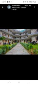 a screenshot of a building with a picture of a street at Hotel Bien Venue in Pokhara