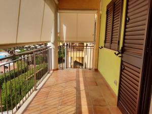 an empty balcony of a house with a door at Dimora sul mare in Policoro