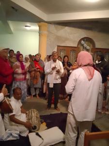 a group of people standing around in a room at Hotel Bien Venue in Pokhara