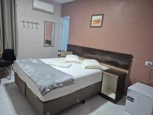 a bedroom with a bed in a room at Hotel Faf's Interlagos - SP in São Paulo