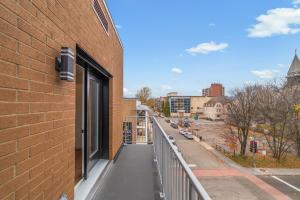 a balcony of a building with a view of a street at Appart'hôtel Vivéo - Par Aneyro in Quebec City