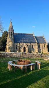 a church with a table in front of a building at St Michaels Lodge in Richmond