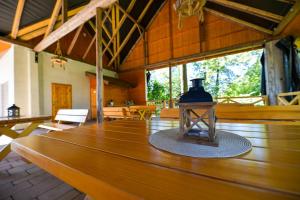 a large wooden table with a light on top of it at Apartamenty Tilia Laskowa - Zator in Laskowa