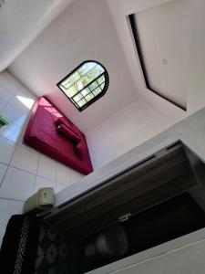 an overhead view of a bathroom with a window at YouYouKe Pavillon Karangpapak in Cilauteureun